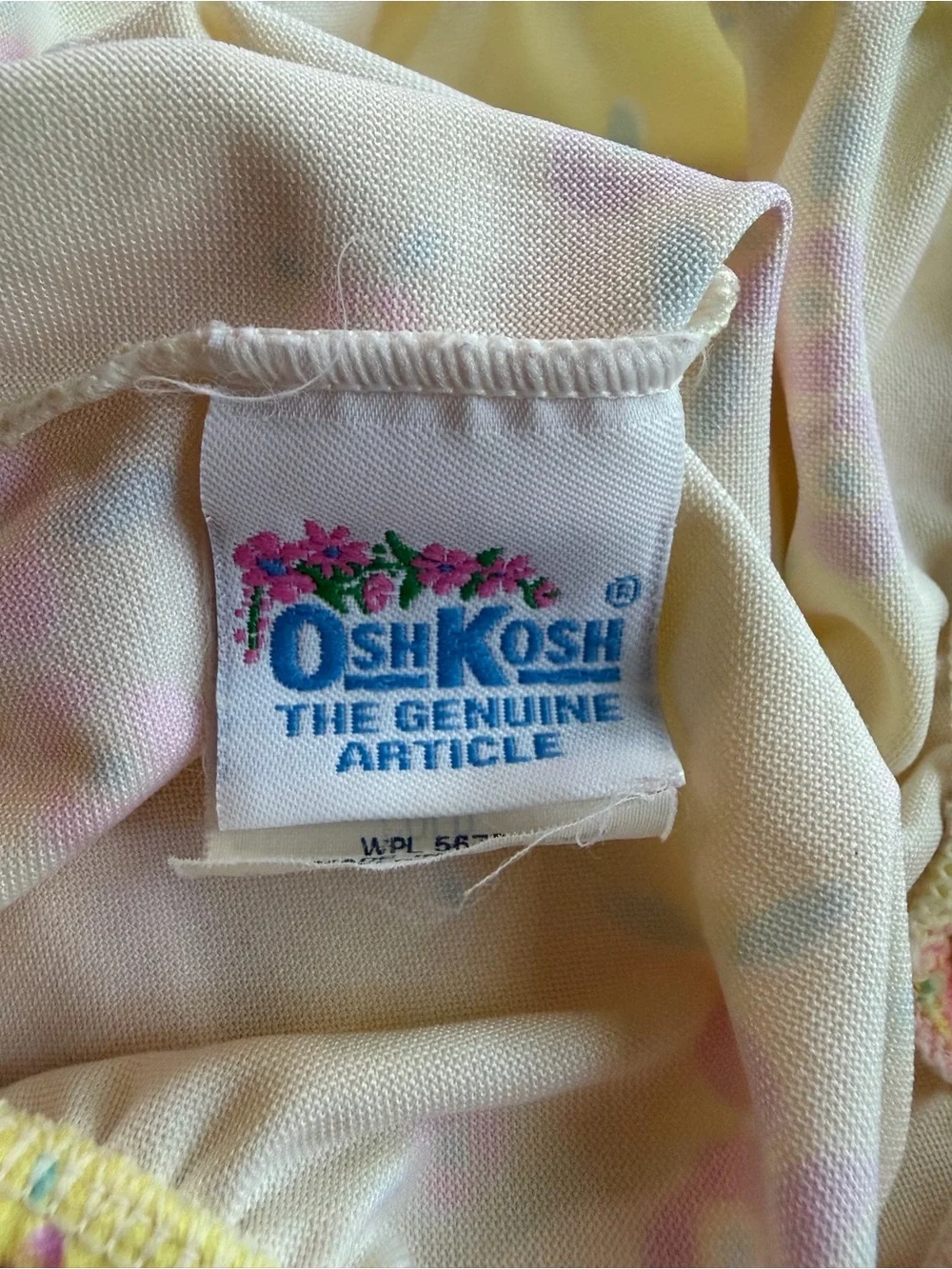 VINTAGE OshKosh B'gosh Yellow Baby Garment with Blue Logo and Pink Floral Accent